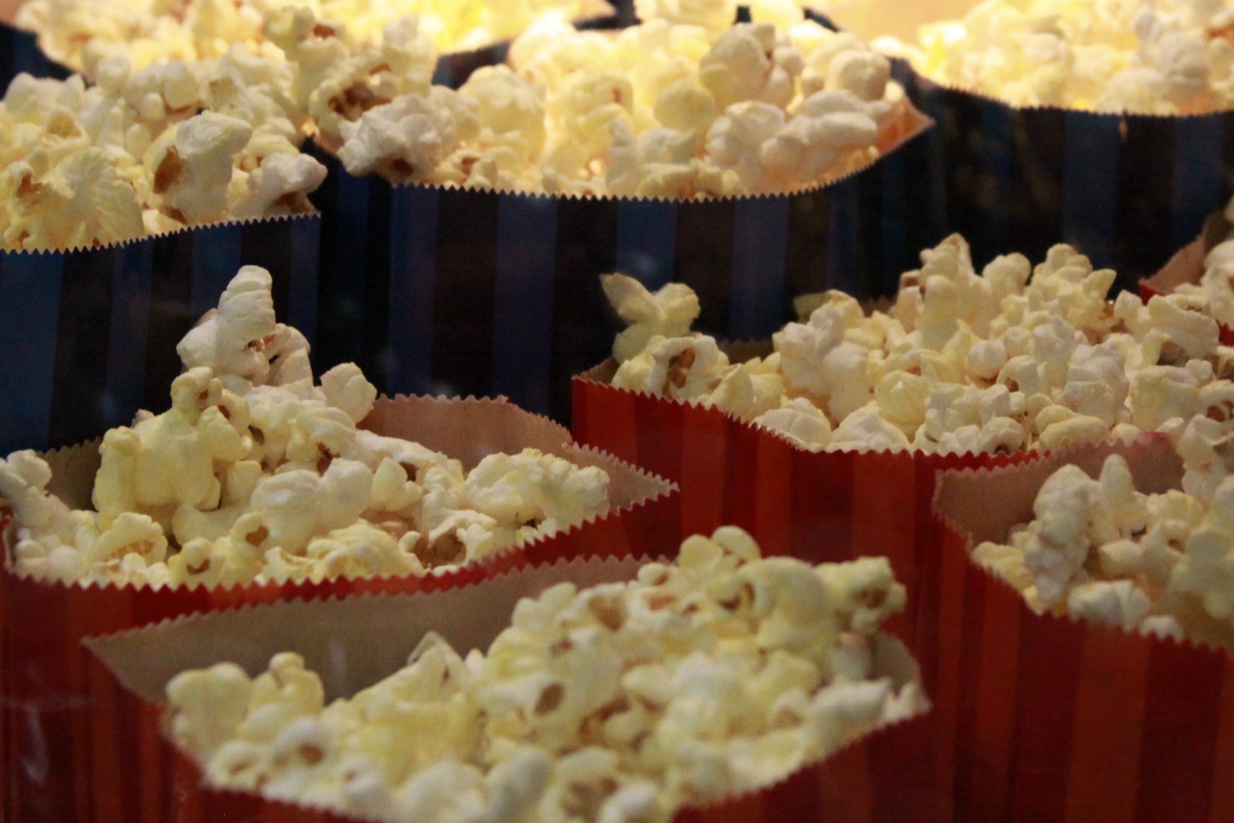 Popcorn in striped cartons at the concession