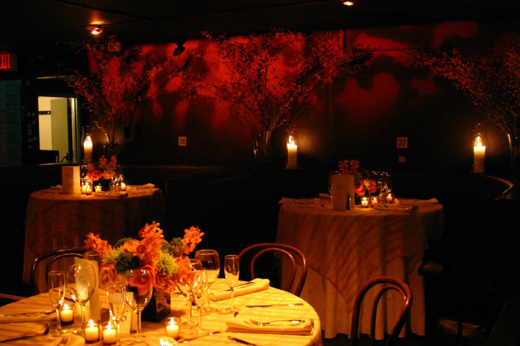 Tables and chairs set across the auditorium floor before an event